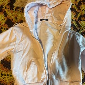 Light pink cropped brandy Melville zip up sweater